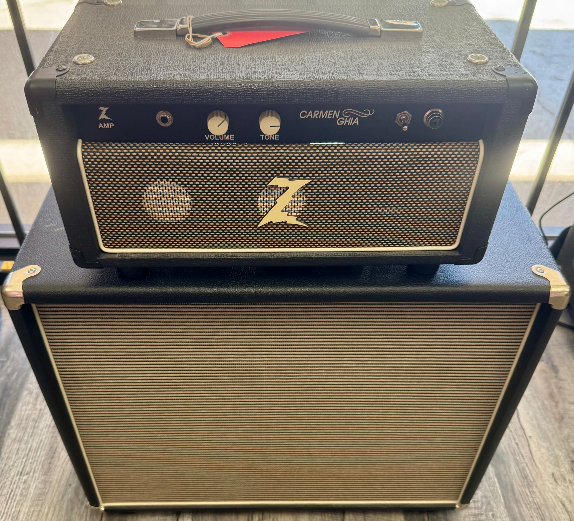 Two guitar amplifiers stacked on top of each other with visible branding.