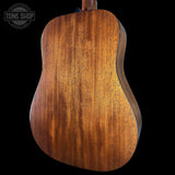 Back view of a wooden acoustic guitar with 'Tone Shop' logo.