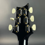 Back of headstock of Used 2024 PRS McCarty 594 10 Top Charcoal Burst.