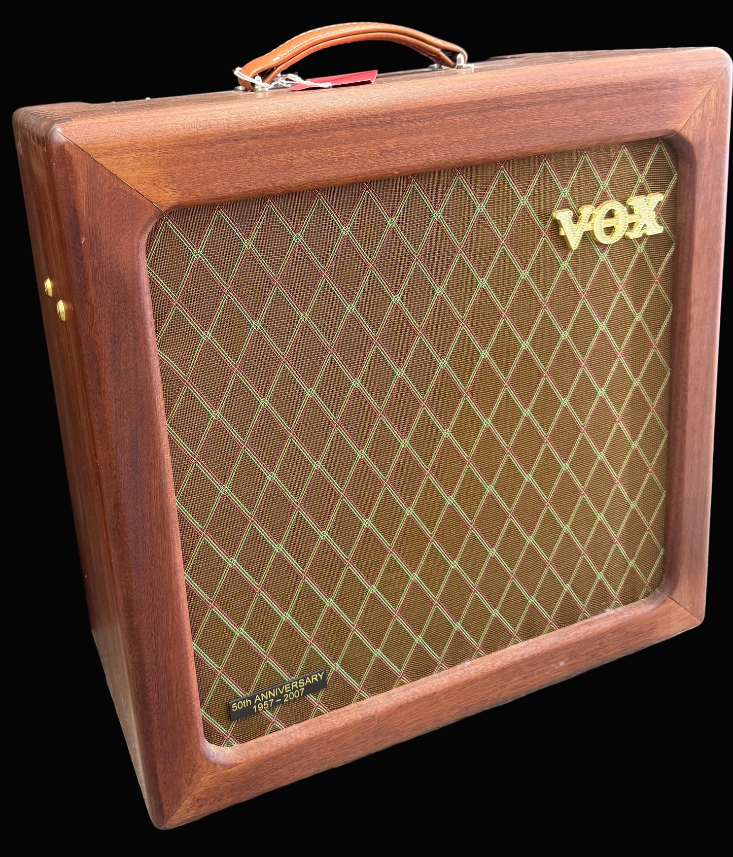 Wooden VOX amplifier with diamond pattern on the front panel