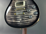 Front angle of Used 2024 PRS McCarty 594 10 Top Charcoal Burst.