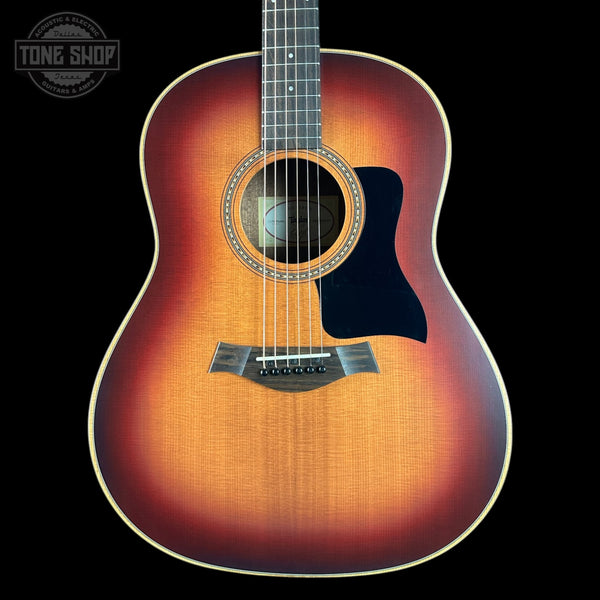 Taylor 117e Studio Prototype Sapele/Spruce with a sunburst finish on a black background, featuring the Tone Shop logo.