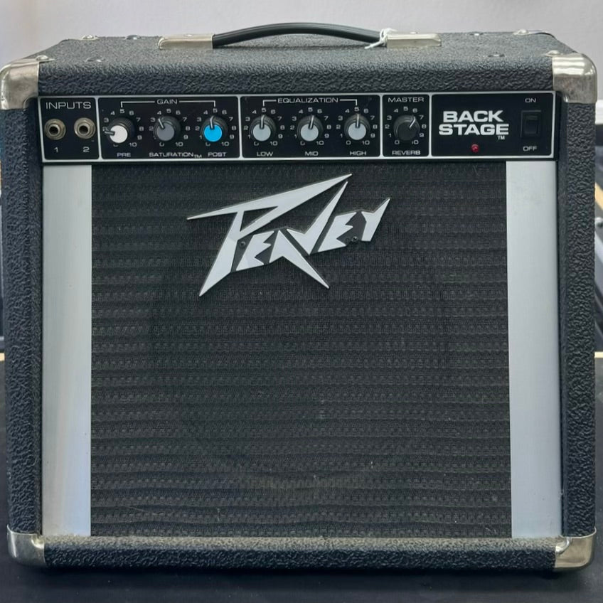 Peavey guitar amplifier with control panel and logo on a dark background