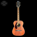 A Fender acoustic guitar with a natural wood body and neck, shown against a solid black background. A 'TONE SHOP' watermark is visible in the top-left corner.
