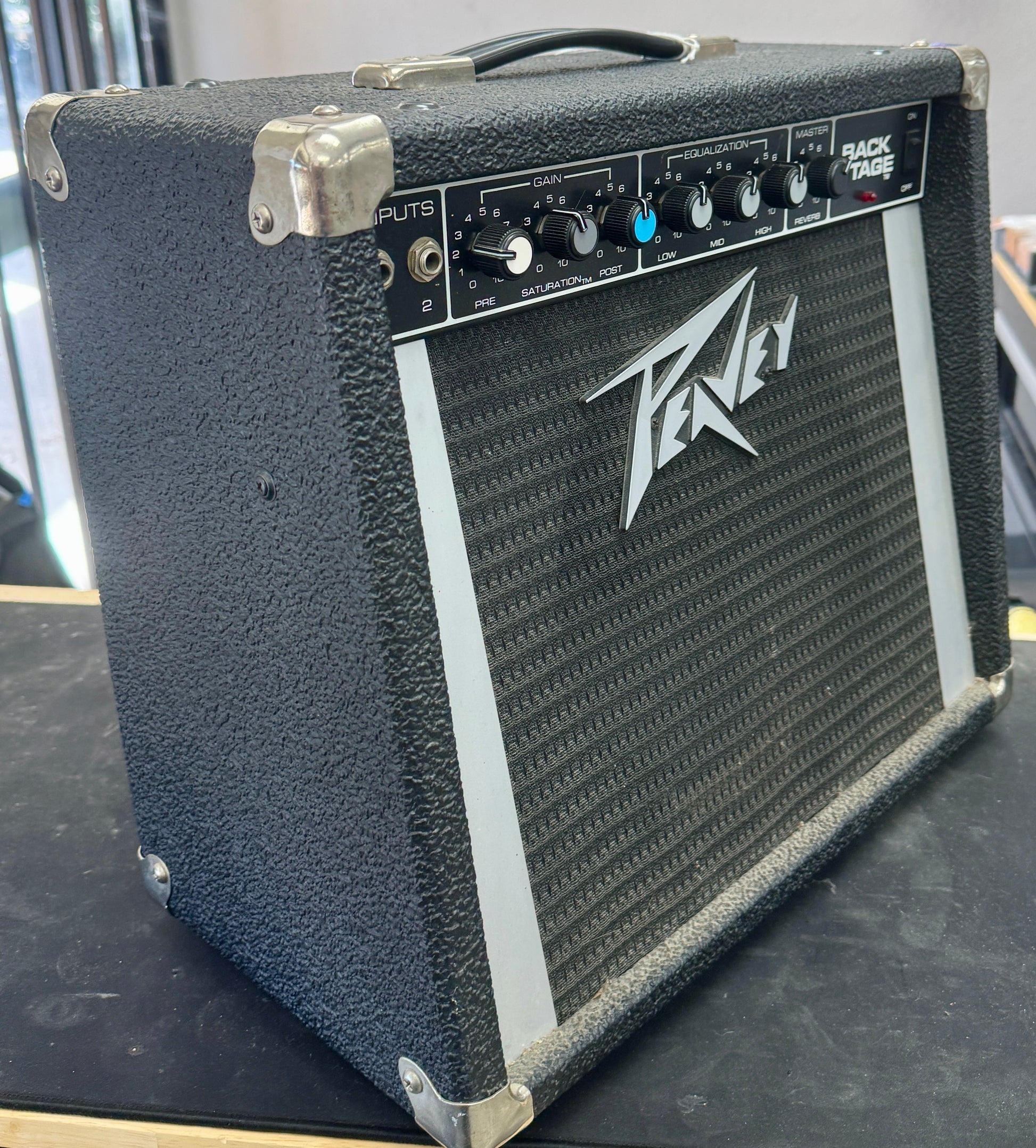 Peavey guitar amplifier on a black surface