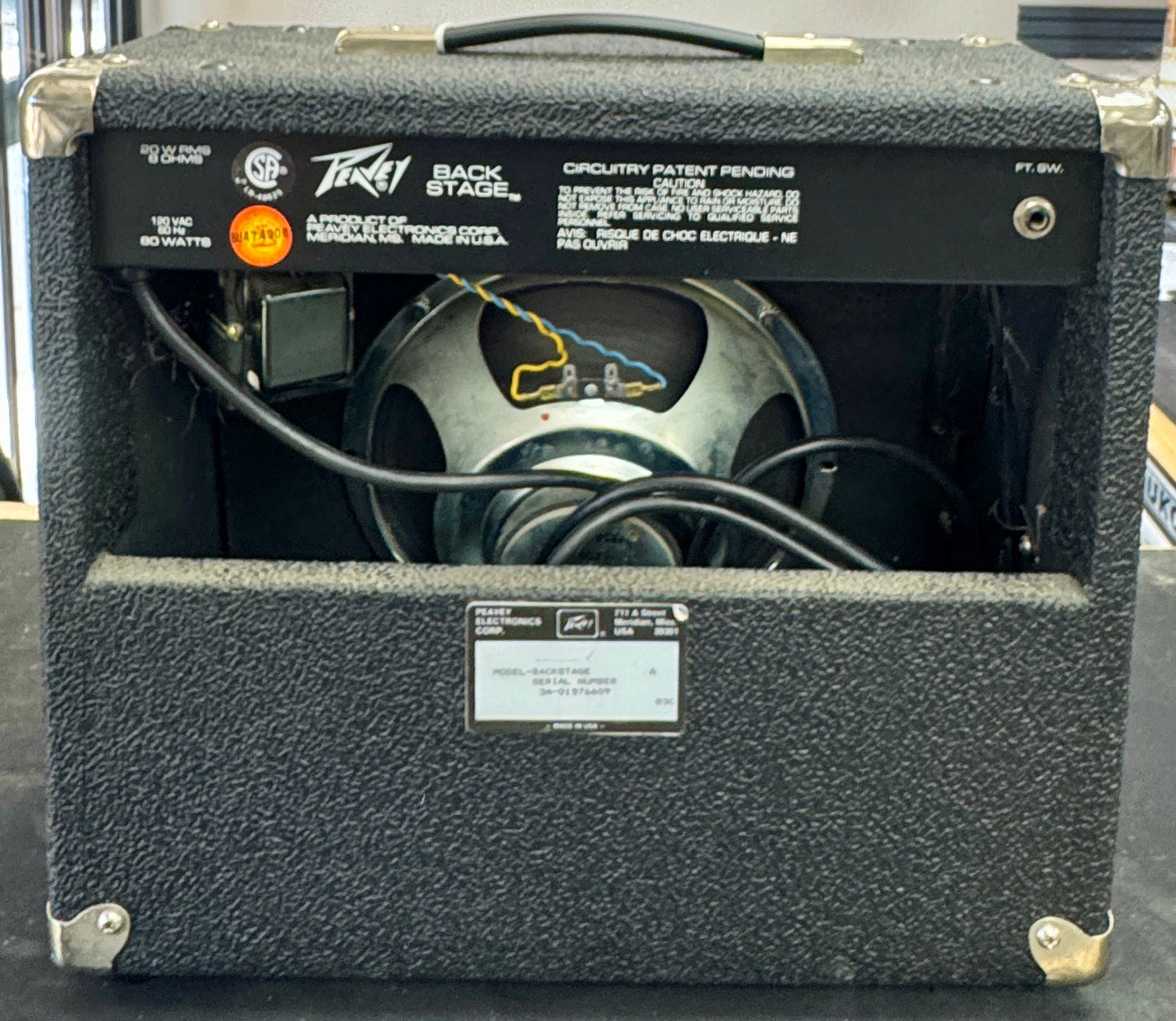 Peavey guitar amplifier with visible branding and specifications on a black surface