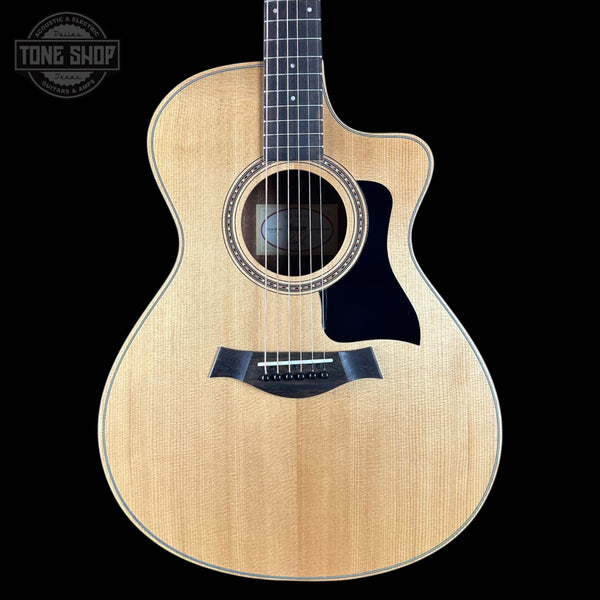 Taylor 112ce Studio Prototype Acoustic guitar with a visible brand logo on a black background