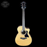 Taylor 114ce Studio Prototype Sapele/Spruce Acoustic guitar with a visible brand logo on a black background