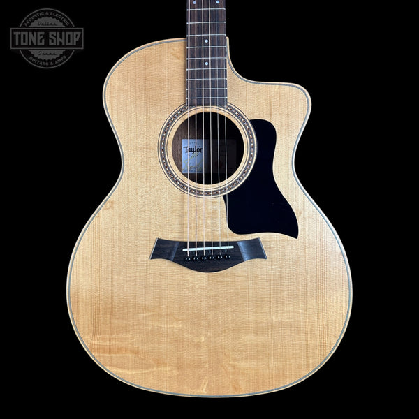 Taylor 114ce Studio Prototype Sapele/Spruce on a black background