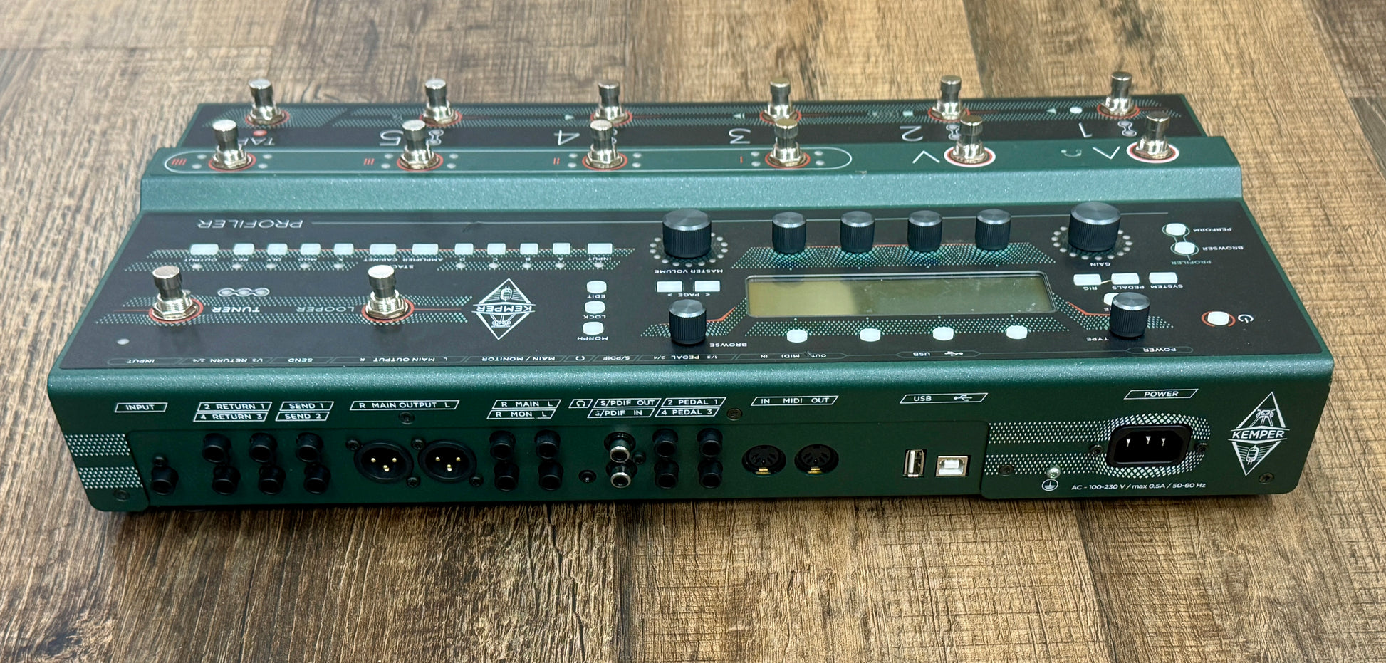 Guitar effects pedal on a wooden surface