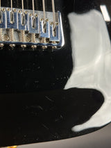 Wear on body of Used Schecter Omen-8 Left Handed Black.
