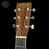 Guitar headstock with 'Martin & Co' branding on a black background