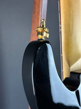 Wear on back of Used Schecter Omen-8 Left Handed Black.