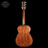 Wooden acoustic guitar on a black background with 'Tone Shop' logo.
