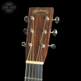 Guitar headstock with Martin & Co. logo on a black background