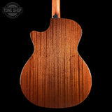 Taylor 314ce Prototype Next Generation  Back view of a wooden acoustic guitar with 'Tone Shop' logo in the corner.