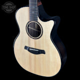 Taylor Builder's Edition 914ce Prototype Next Generation Acoustic guitar with a black pickguard on a black background, featuring the Tone Shop logo.
