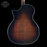 Back view of Taylor Builder's Edition 514ce Prototype with a dark wood finish on a black background, featuring the Tone Shop logo.
