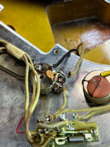Electrical components with wires and a resistor on a metallic surface