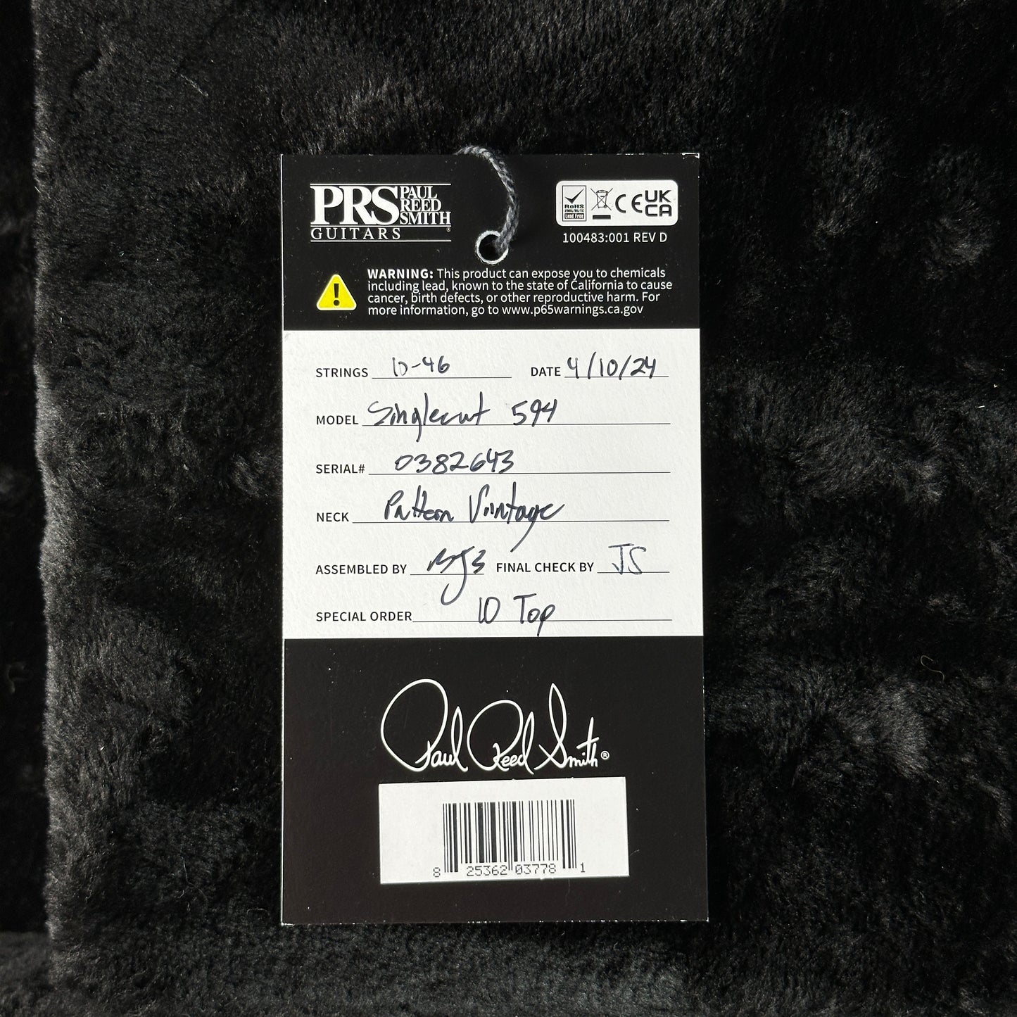 PRS Guitars label on a textured black background