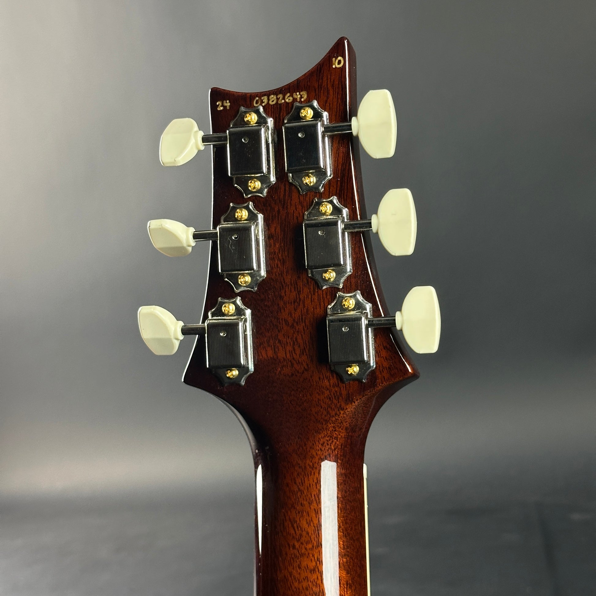 Back of headstock of Used PRS McCarty 594 Singlecut 10-Top Tobacco Sunburst.