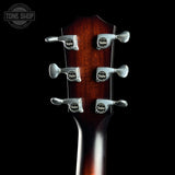 Taylor Builder's Edition 514ce Prototype back of headstock on a black background. 