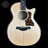 Taylor Builder's Edition 514ce Prototype Acoustic guitar with a tiger stripe design on a black background, featuring the Tone Shop logo.