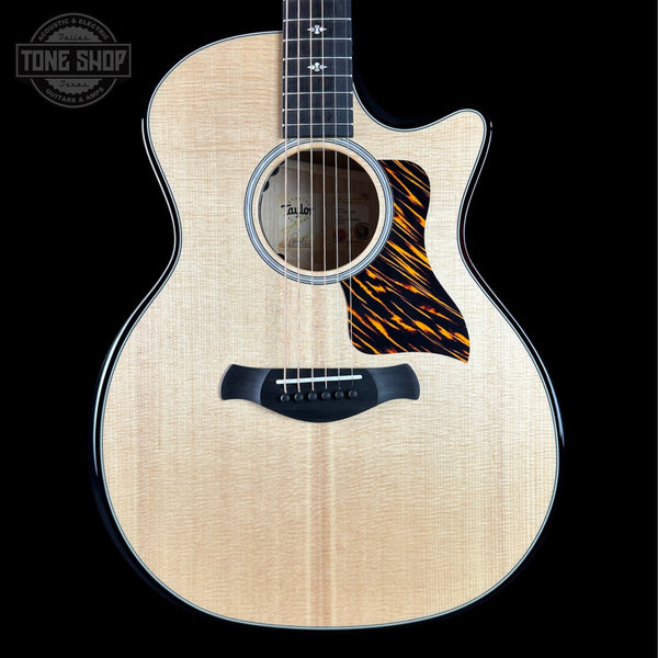 Taylor Builder's Edition 514ce Prototype Acoustic guitar with a tiger stripe design on a black background, featuring the Tone Shop logo.