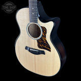 Taylor Builder's Edition 514ce Prototype Acoustic guitar with a black pickguard on a black background, featuring the Tone Shop logo.