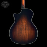 Back view of a Taylor Builder's Edition 514ce Prototype with a dark brown finish on a black background, featuring 'Tone Shop' logo.