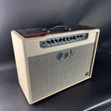 Beige guitar amplifier with 'PRS' branding on a dark background