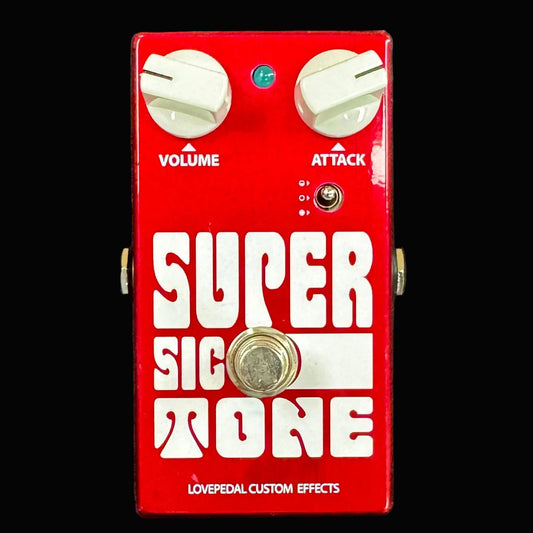 Red guitar effects pedal with 'Super Sic Tone' branding on a dark background