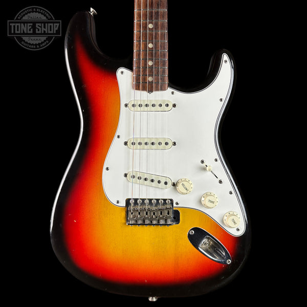 Electric guitar with a sunburst finish on a black background, featuring the Tone Shop logo.