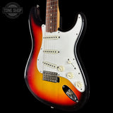 Electric guitar with a sunburst finish on a black background, featuring the Tone Shop logo.