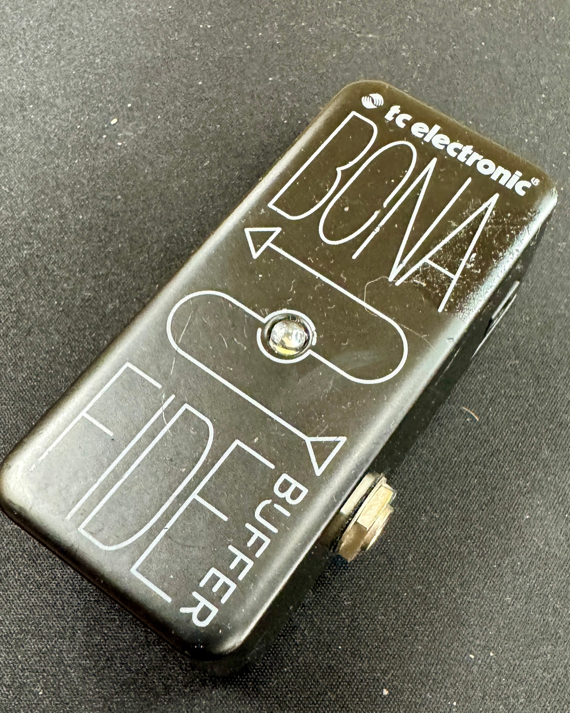 Guitar effects pedal with 'Bona Fide Buffer' branding on a dark background