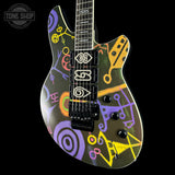 Colorful electric guitar with abstract designs on a black background, featuring the Tone Shop logo.
