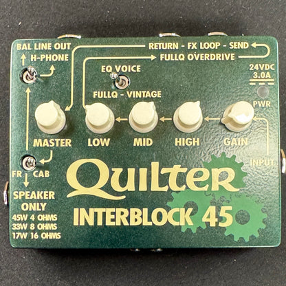 Quilter Interblock 45 guitar effects pedal with control knobs and labels on a green background