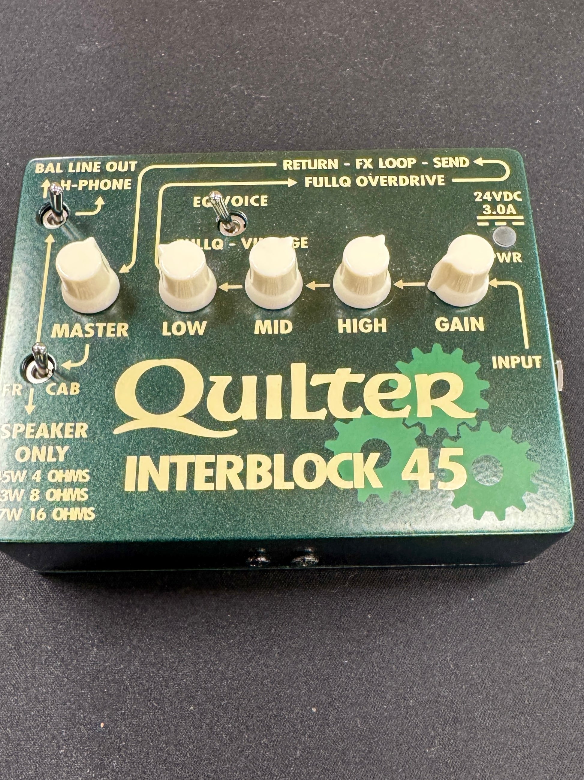 Quilter Interblock 45 guitar effects pedal on a dark background
