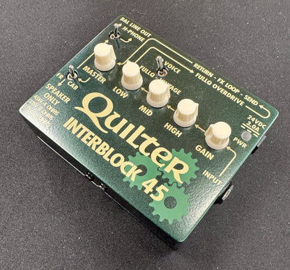 Quilter Interblock 45 guitar effects pedal on a dark background