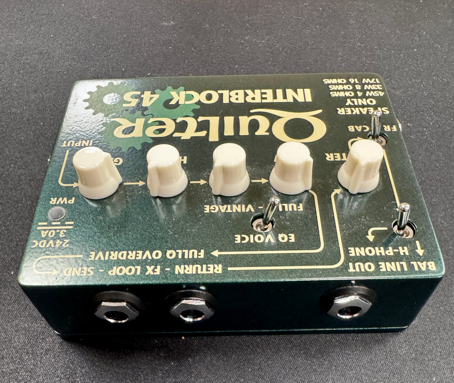 Quilter Interlock 45 guitar effects pedal on a dark background