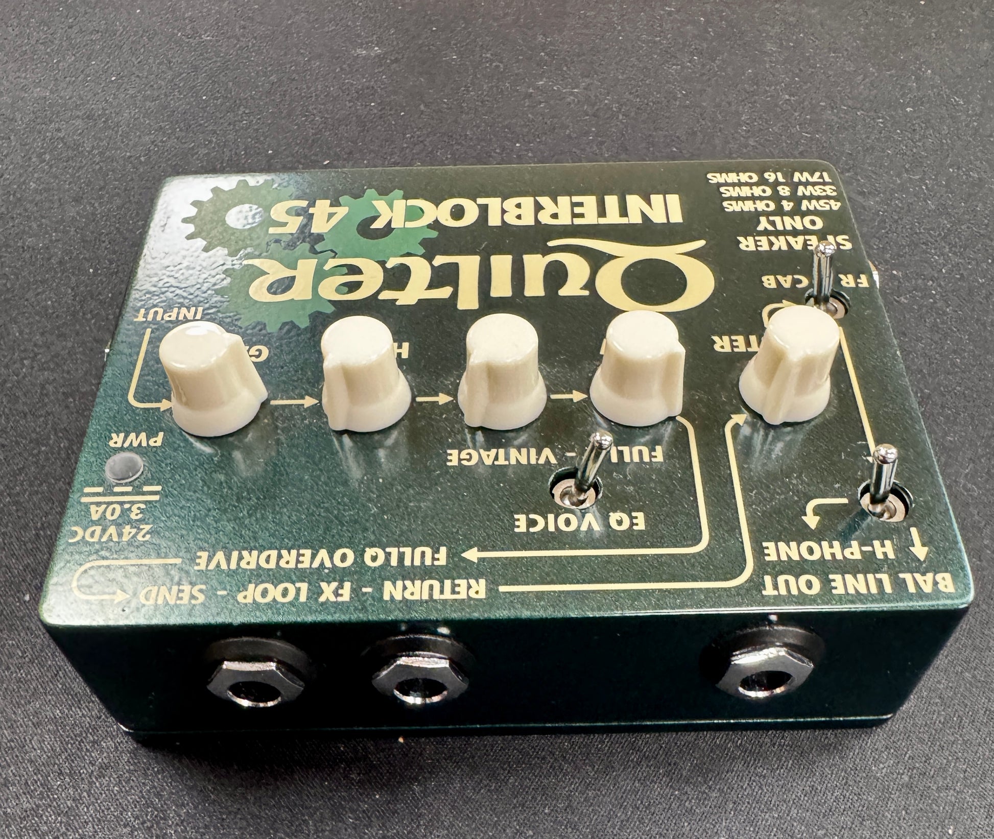 Quilter Interlock 45 guitar effects pedal on a dark background