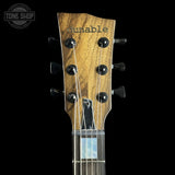 Headstock of Used 2026 Dunable Custom Shop Cyclops Black Limba Natural Black Burst.