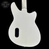 White electric guitar body on a black background with 'Tone Shop' logo.