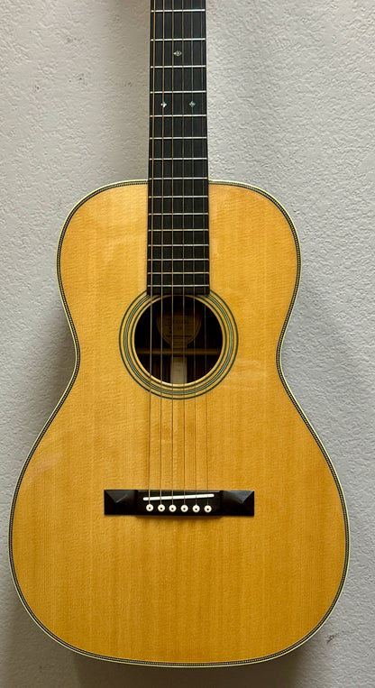 Acoustic guitar against a gray background