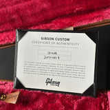Gibson Custom Certificate of Authenticity on a red guitar case