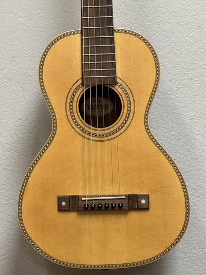 Acoustic guitar against a plain background