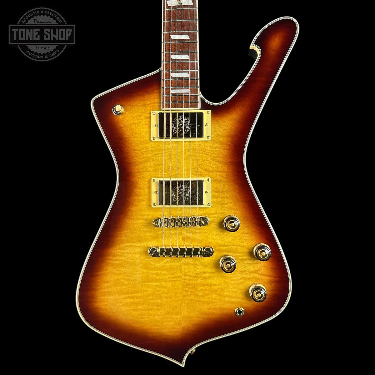 A sunburst electric guitar with a flamed maple body, gold hardware, and a dark brown to black finish, shown against a black background with a Tone Shop watermark in the top left corner.