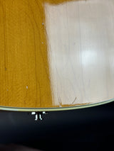 Close-up of a guitar's soundhole and body