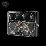 Guitar effects pedal with control knobs and switches on a black background, featuring the 'Tone Shop' logo.