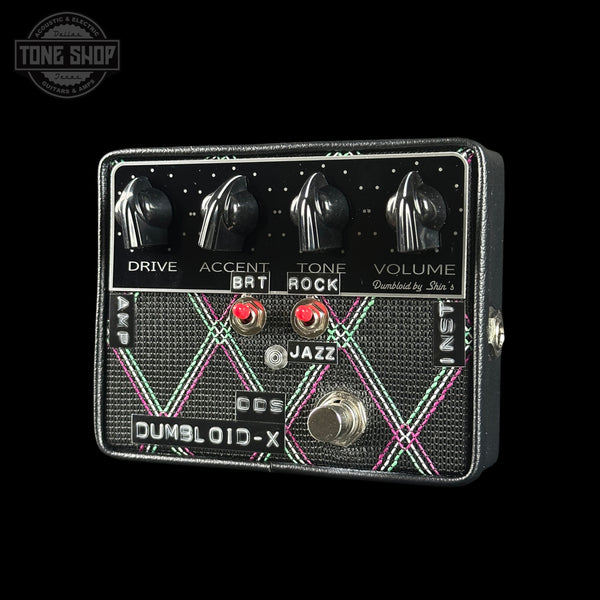 Guitar effects pedal with control knobs and switches on a black background, featuring the 'Tone Shop' logo.